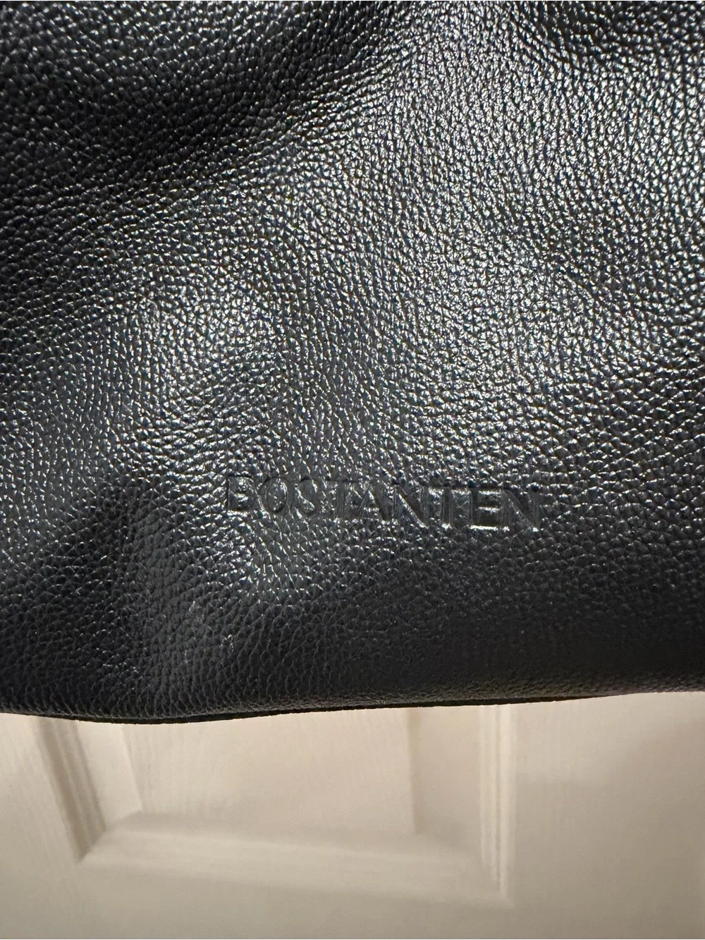 Sleek Black Leather Shoulder Bag with Brown Strap